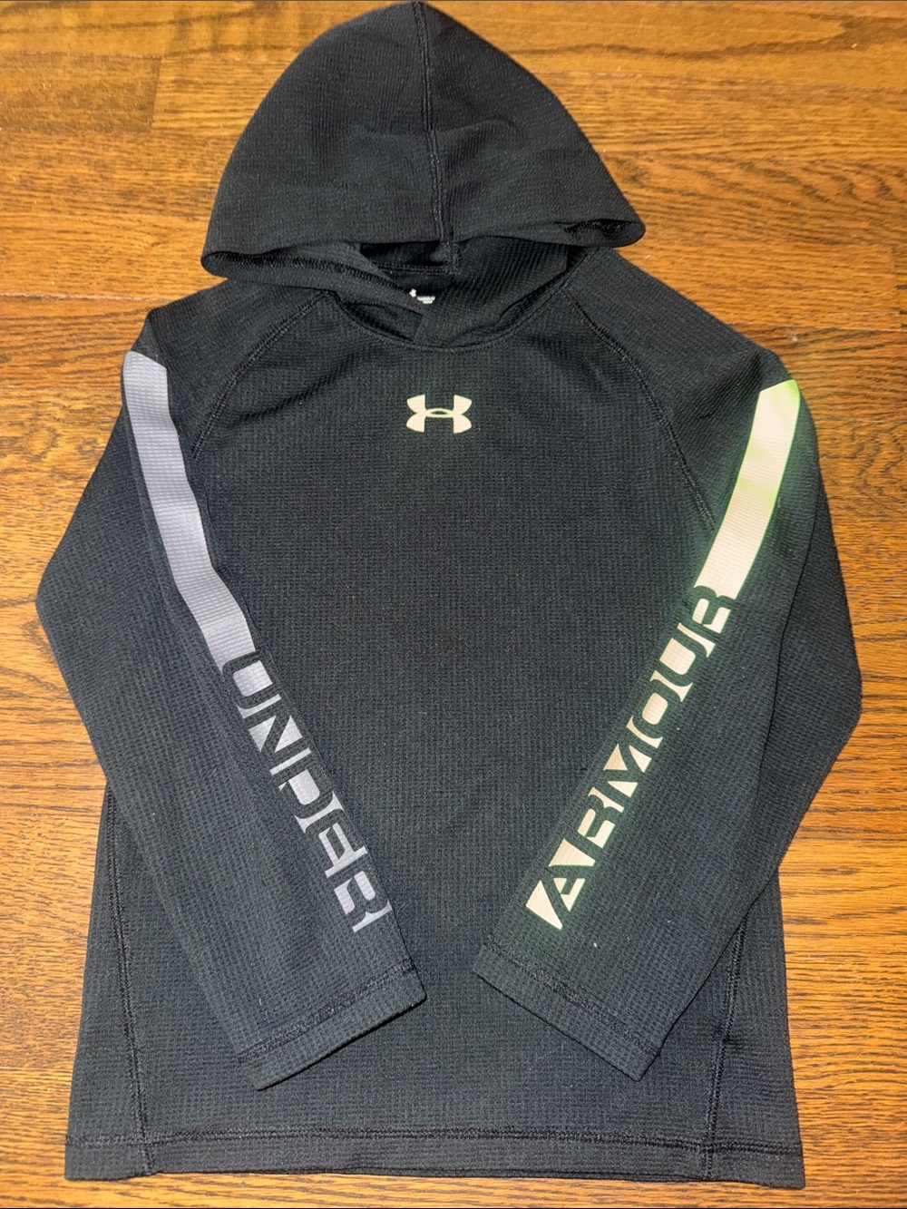 Under Armour boys Black Hooded long sleeve shirt with Reflective sleeves